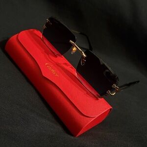 Cartier Men's Gold and Black Rimless Sunglasses with Red Case